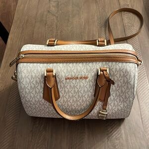 Large Michael Kors handbag with detachable strap.